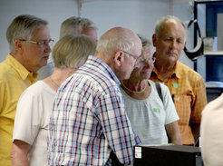 Cell sorting at the highest stage: interested visitors listen to the explanation of flow cytometry function and usage at the MPI-IE.